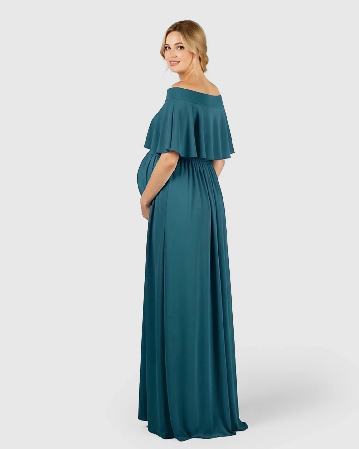 Teal chiffon off-shoulder bohemian maternity photoshoot dress with a ruffled neckline and flowing skirt.