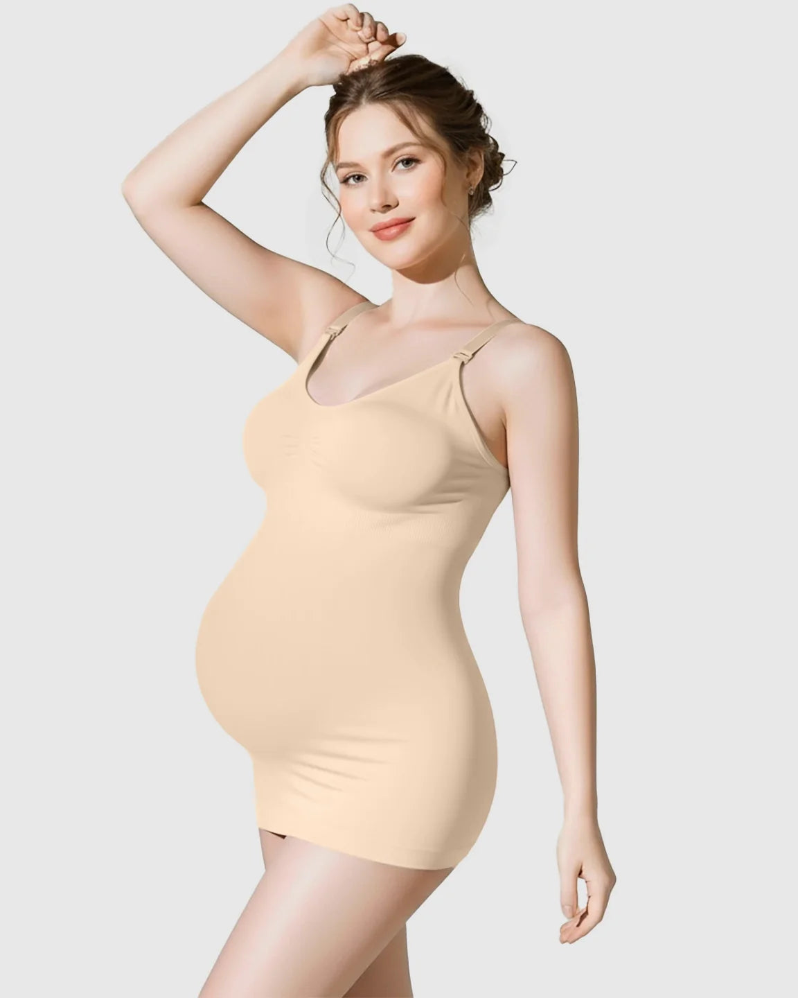 Pregnant woman in a nude soft stretch front-opening wireless maternity nursing bra and matching camisole.