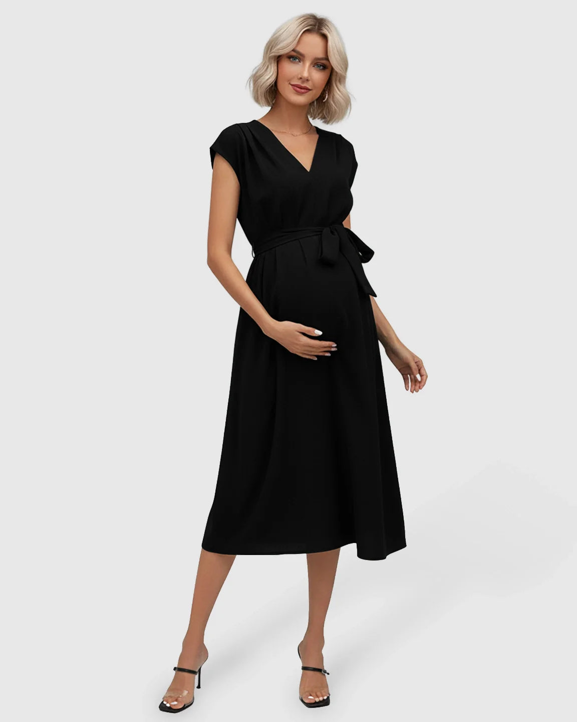 Black tie-waist V-neck maternity midi dress with flutter sleeves, worn by a pregnant woman.