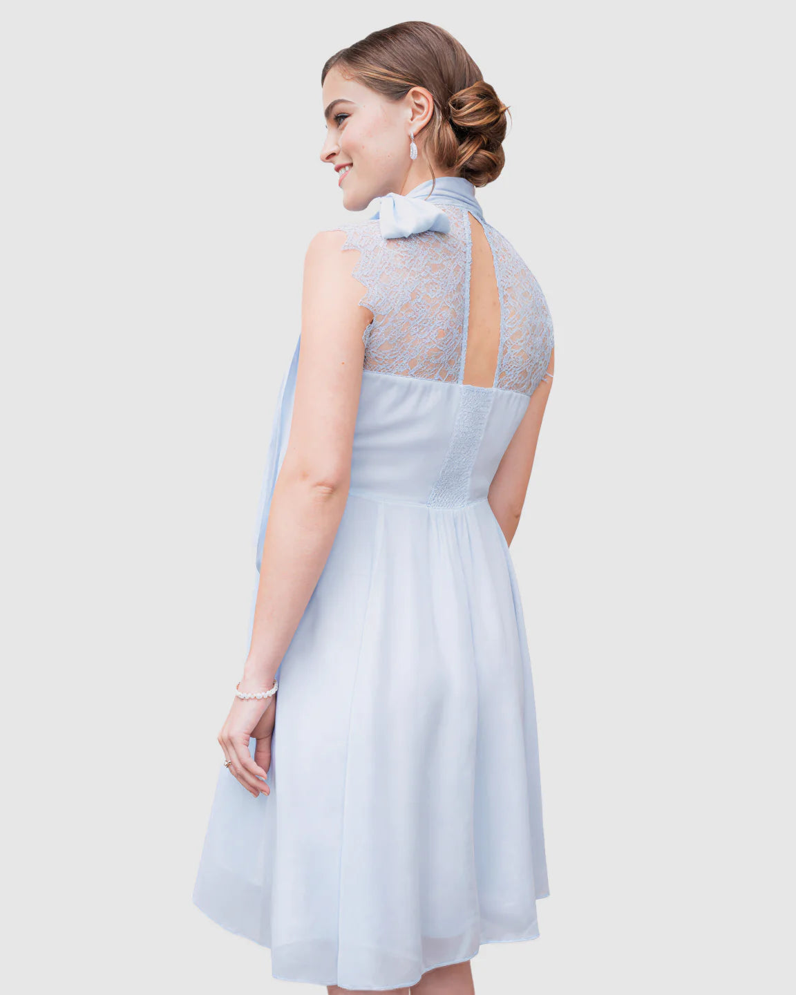 Light blue chiffon maternity midi dress with high neck, back tie detail, and lace bodice.