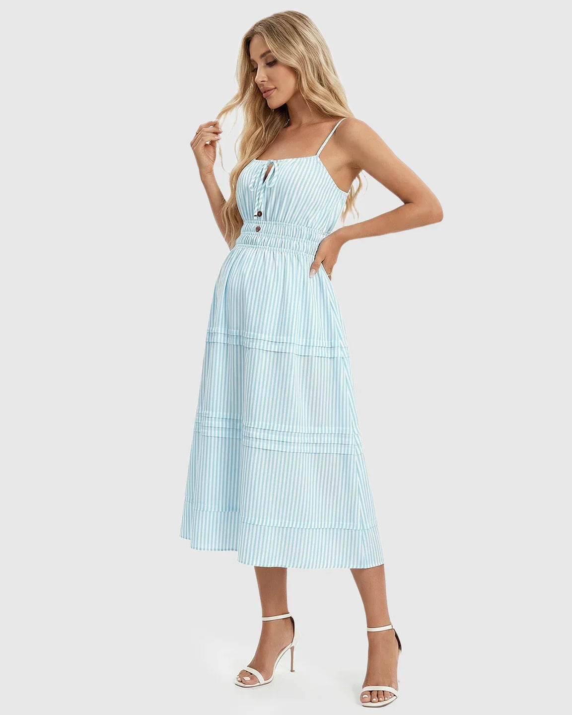 Maternity midi dress: blue and white striped A-line with smocked waist, spaghetti straps, and tiered hem.