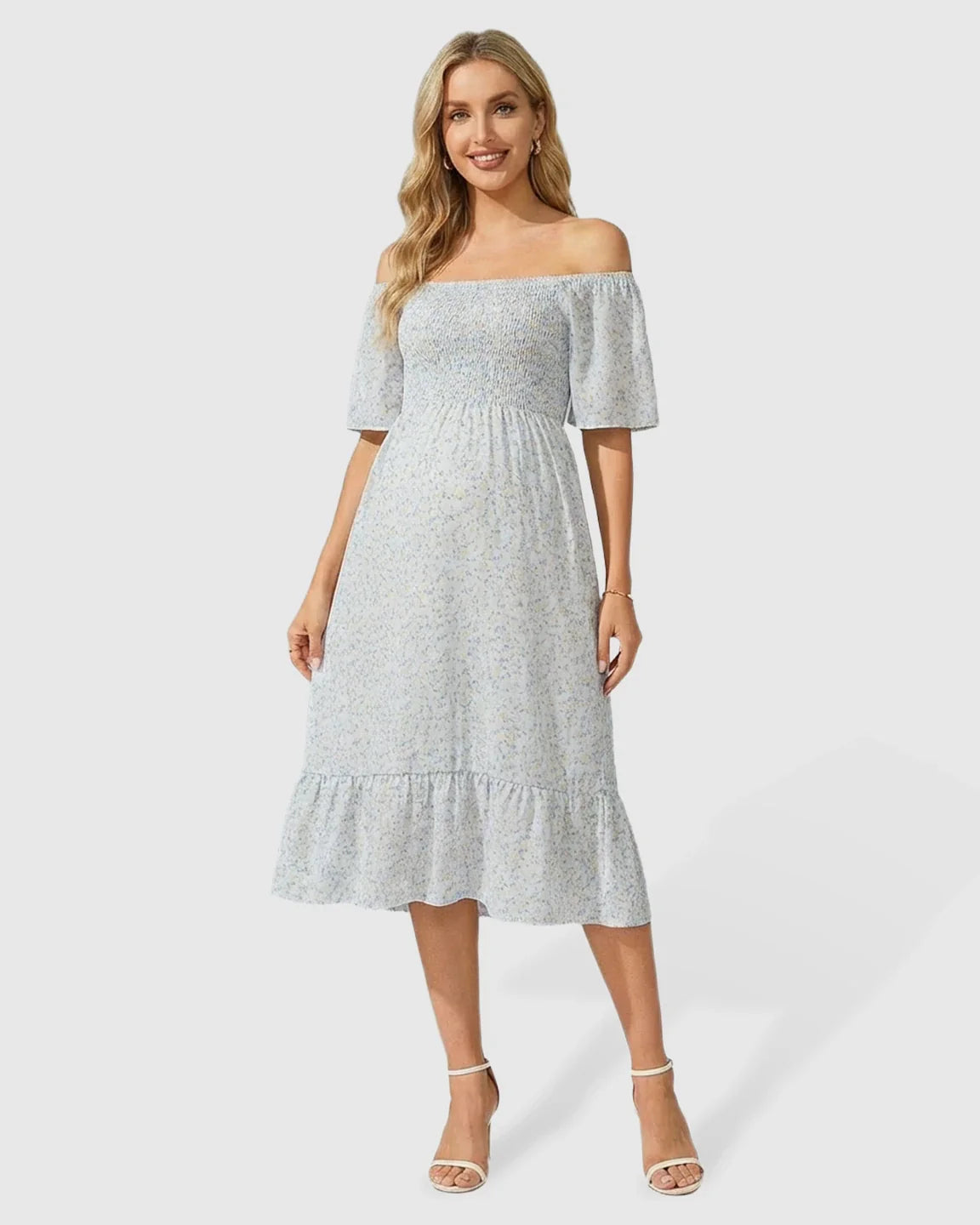 Light blue floral off-shoulder smocked maternity midi dress with flutter sleeves and tiered skirt.
