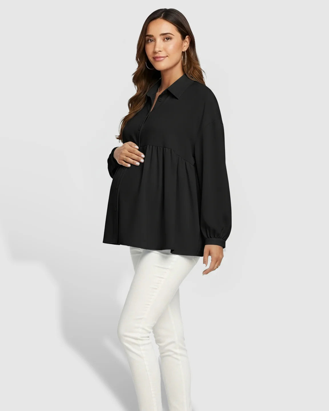 Maternity model wearing a black chiffon lapel long sleeve babydoll shirt with white pants.