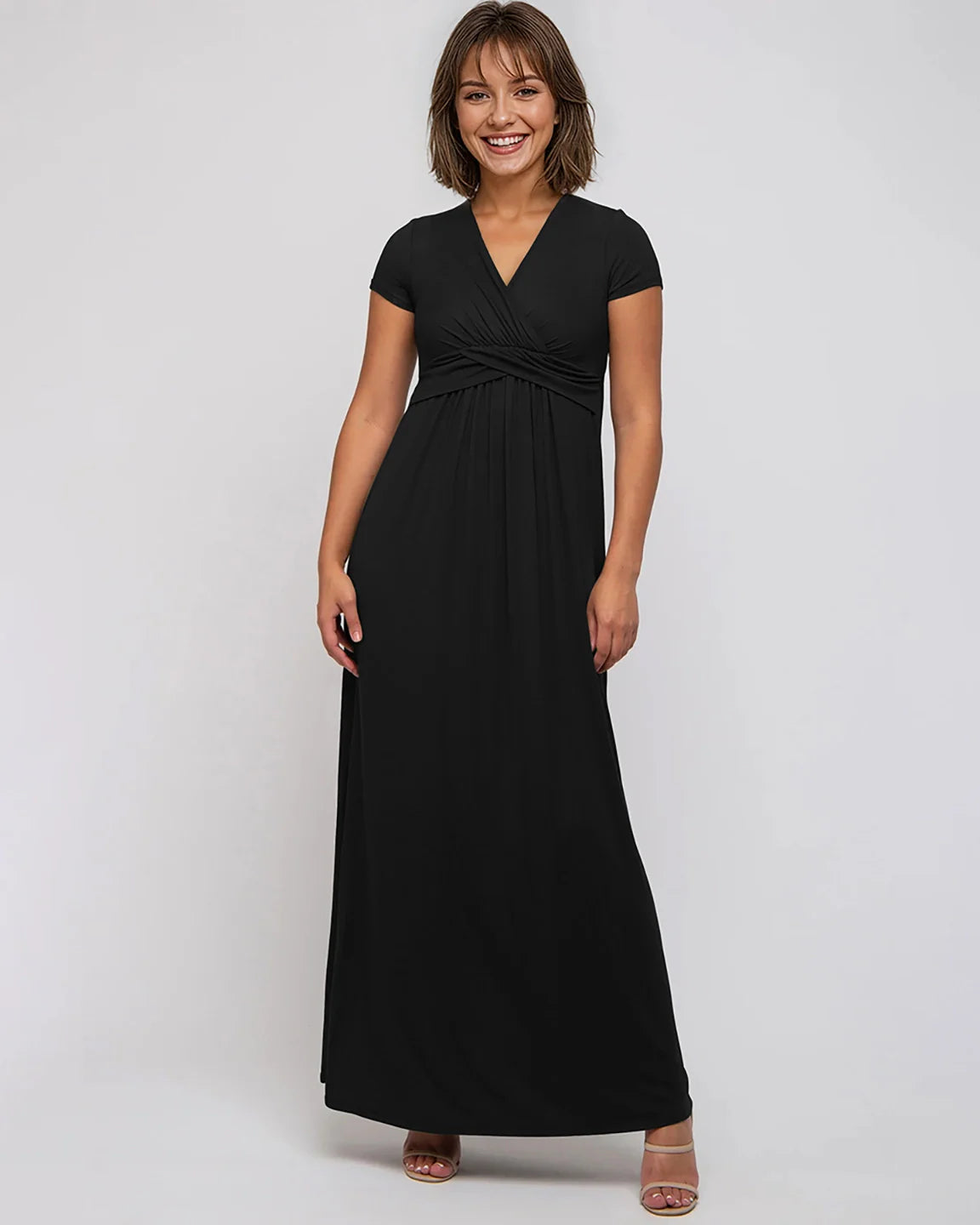 Smiling woman in a black Twist Front Draped Maternity Nursing Maxi Dress with short sleeves.