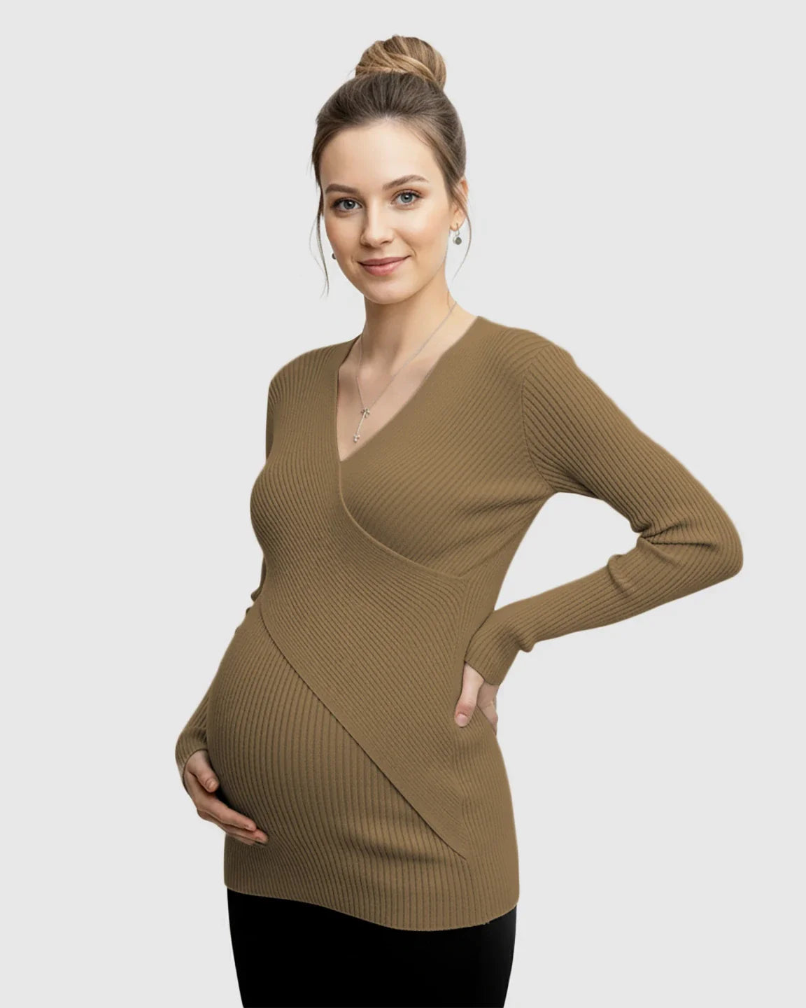 Smiling pregnant woman in a brown faux-wrap ribbed maternity top, highlighting her bump.