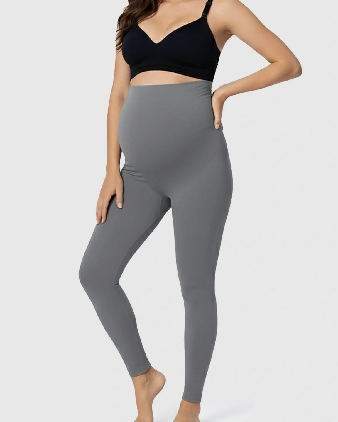 Pregnant woman wearing gray Bump Society Belly Support Stretch Maternity Leggings with a high waist panel.