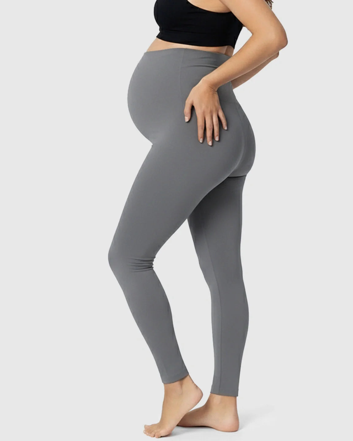 Pregnant woman wearing gray Bump Society Belly Support Stretch Maternity Leggings with a high-waist panel.