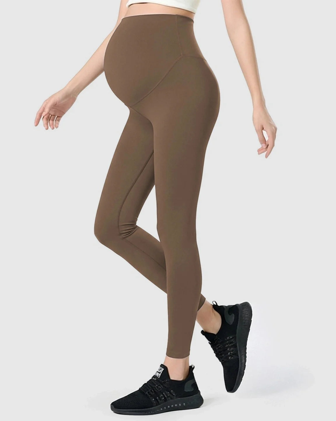 Brown double-layer belly support maternity leggings on a model, showcasing the high-waisted design and stretch fabric.