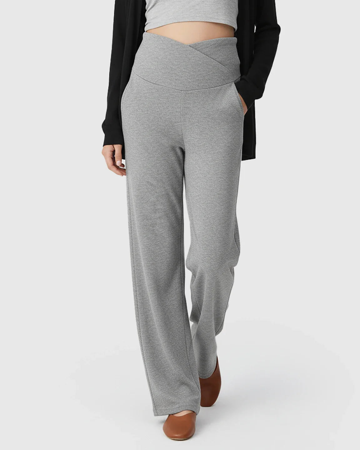 Gray wide-leg maternity lounge pants with a crossover waist, deep side pockets, and soft, stretchy fabric.