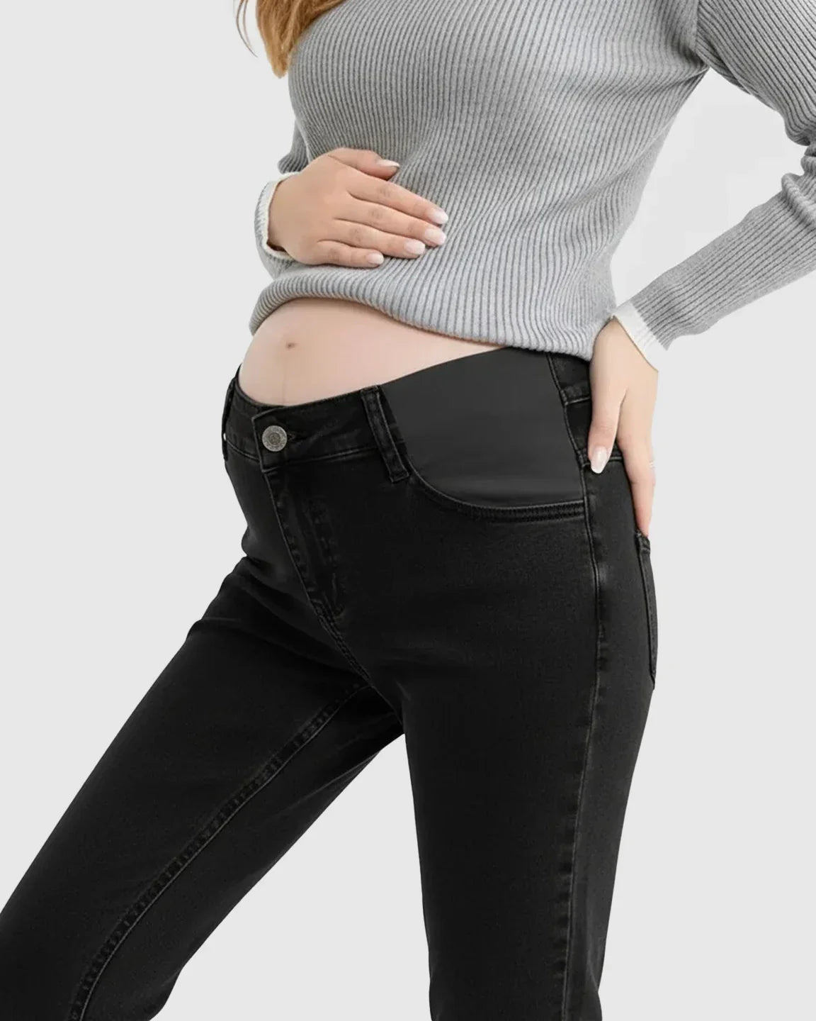 Black straight-leg maternity jeans with high-waist side panels, worn by a pregnant woman in a gray sweater.