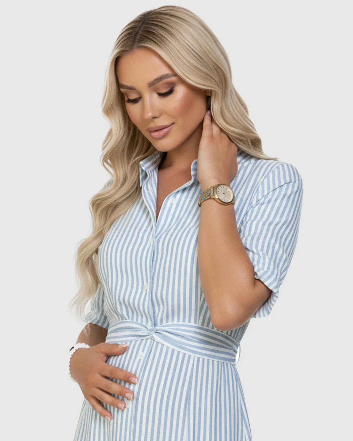 Blonde pregnant woman in a blue and white striped lapel puff-sleeve A-line maternity dress.