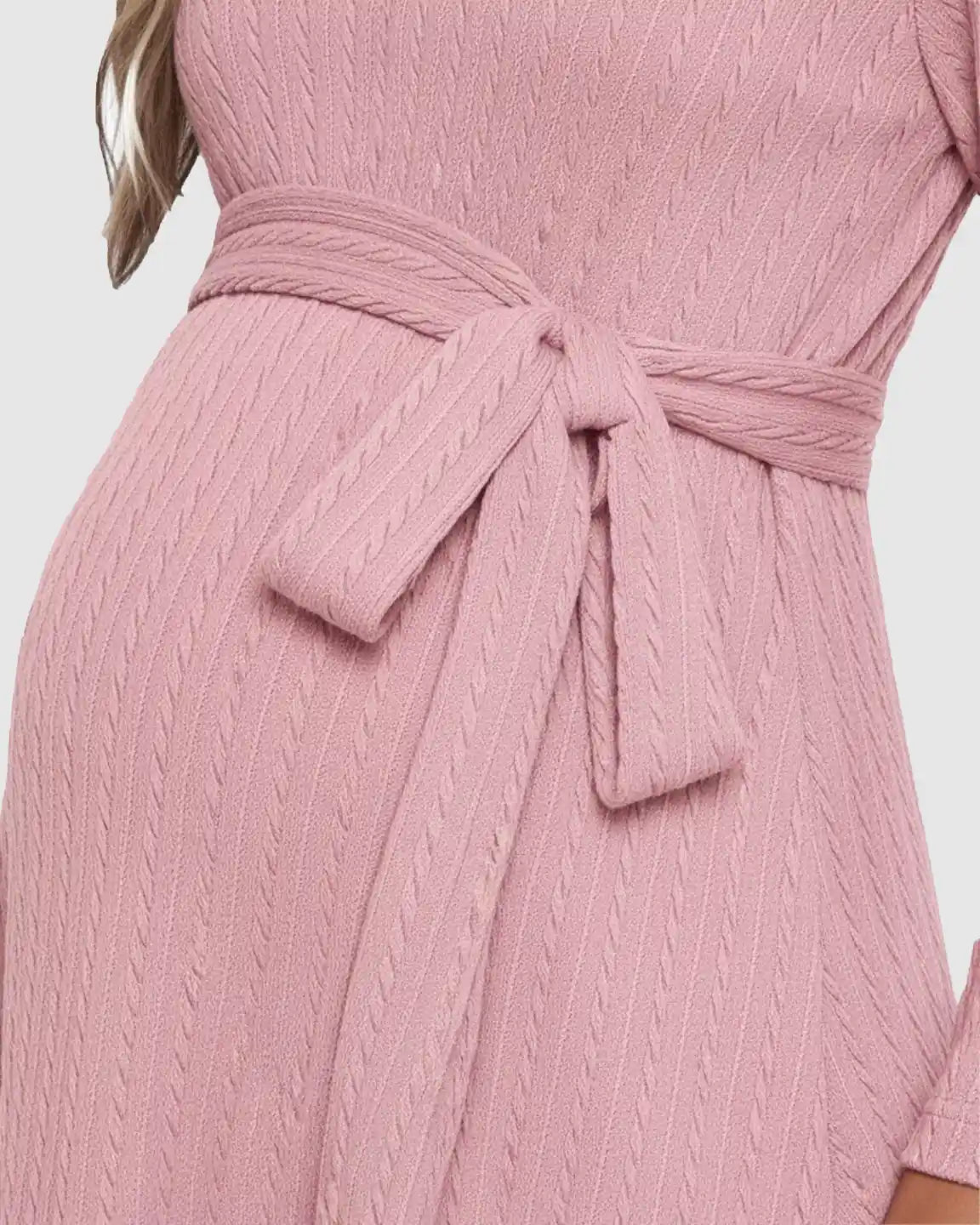 Pink ribbed knit maternity midi dress with a tied waist, showcasing the bump.