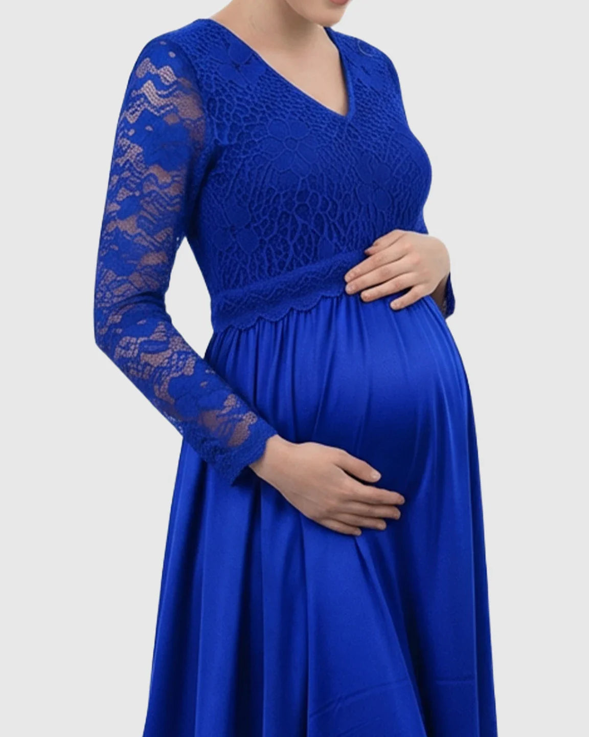 Royal blue maternity maxi dress with lace-spliced V-neck bodice and flowing skirt, highlighting a pregnant belly.