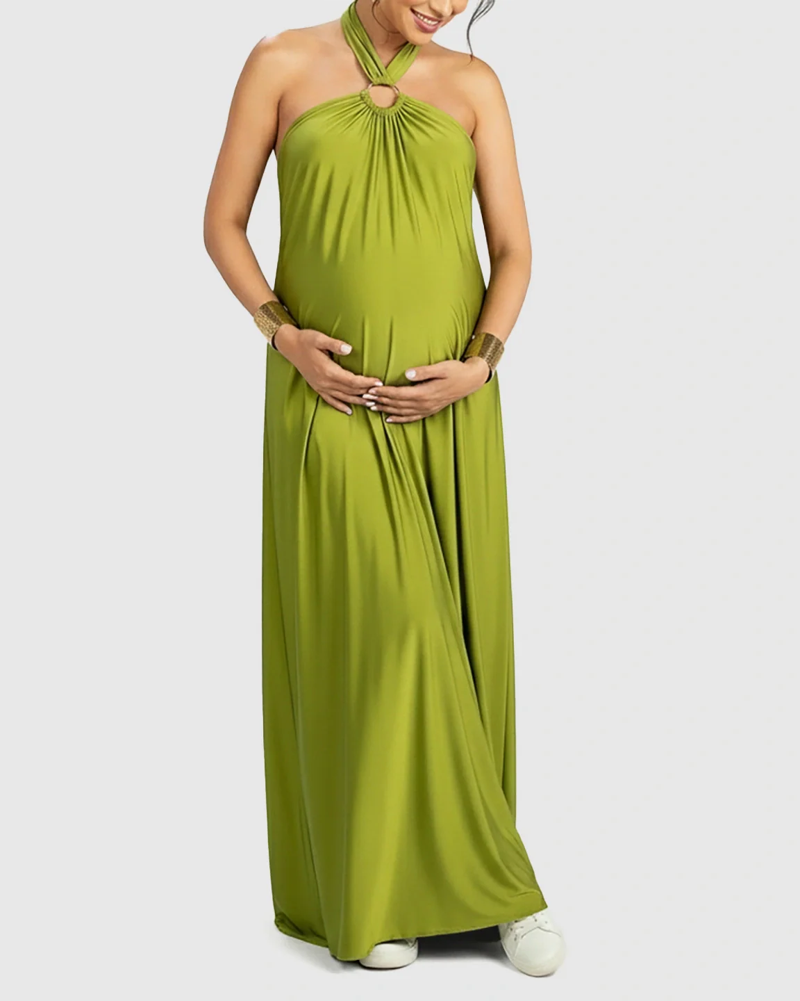 Green backless halter neck chiffon maternity maxi dress with a flowing skirt.