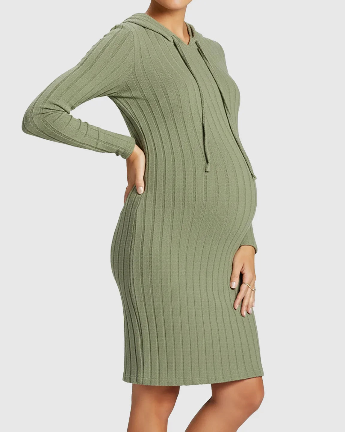 Maternity model in a green ribbed bodycon hooded midi dress with long sleeves, showcasing a comfortable fit.