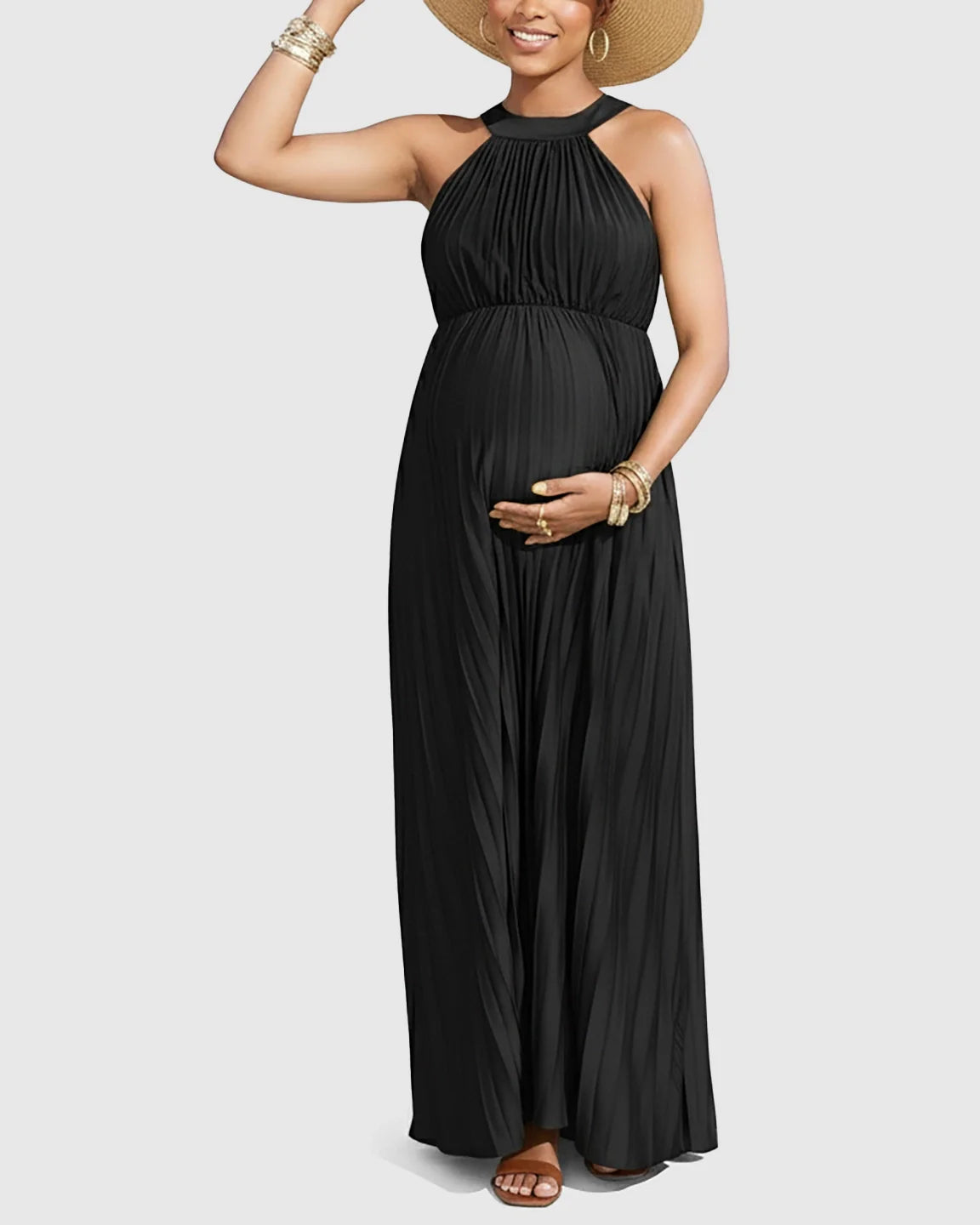 Black faux silk pleated halter neck maternity maxi dress with a flowing silhouette.