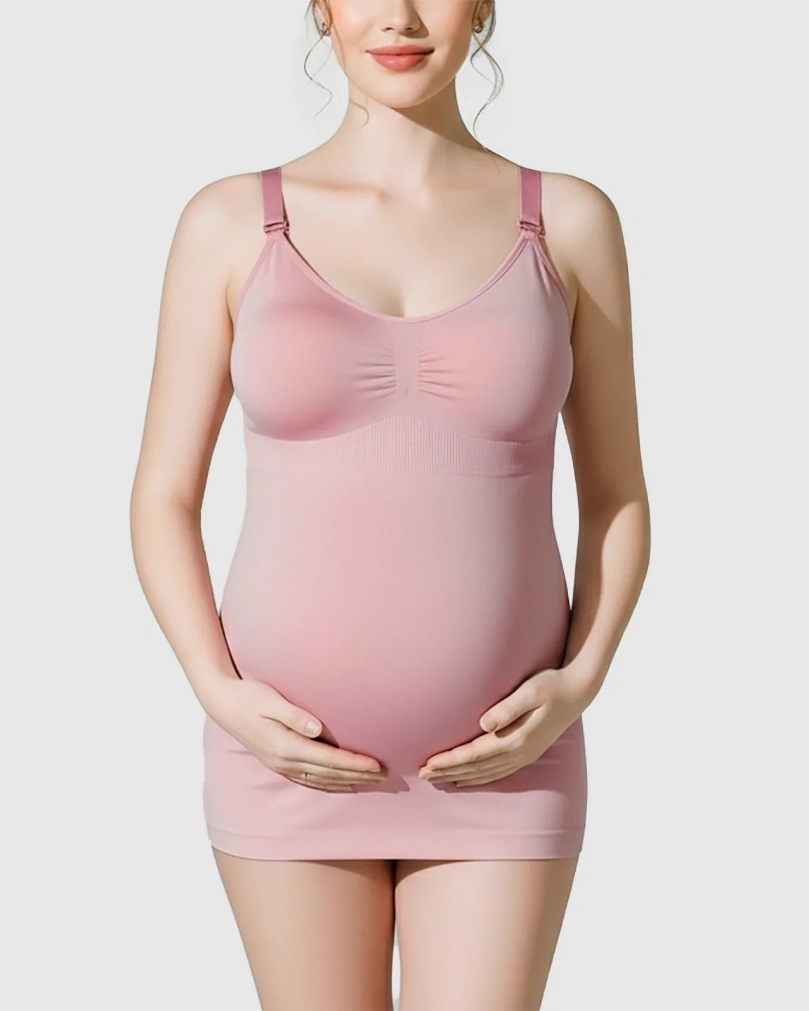 Pink soft stretch front-opening wireless maternity nursing bra camisole on a pregnant model.
