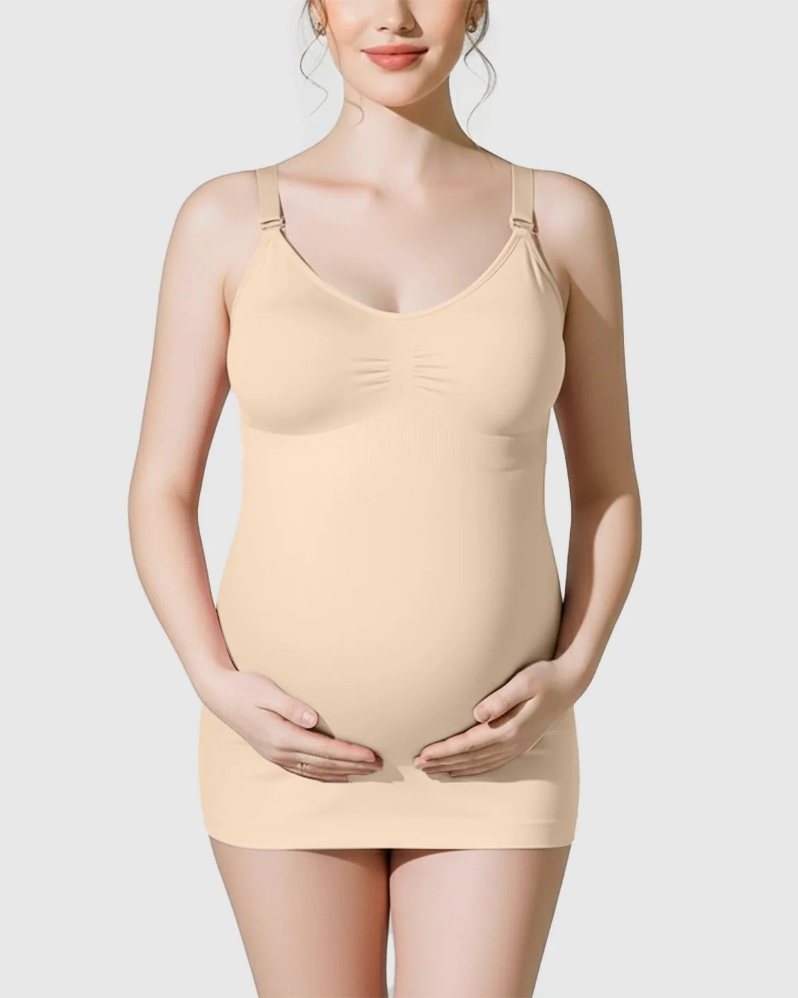 Nude soft stretch maternity nursing camisole with front-opening clasps, worn by a pregnant woman.