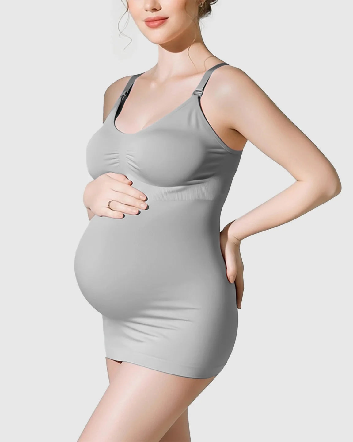 Maternity model in a soft gray, wireless, front-opening nursing bra with a supportive, stretchy fit.