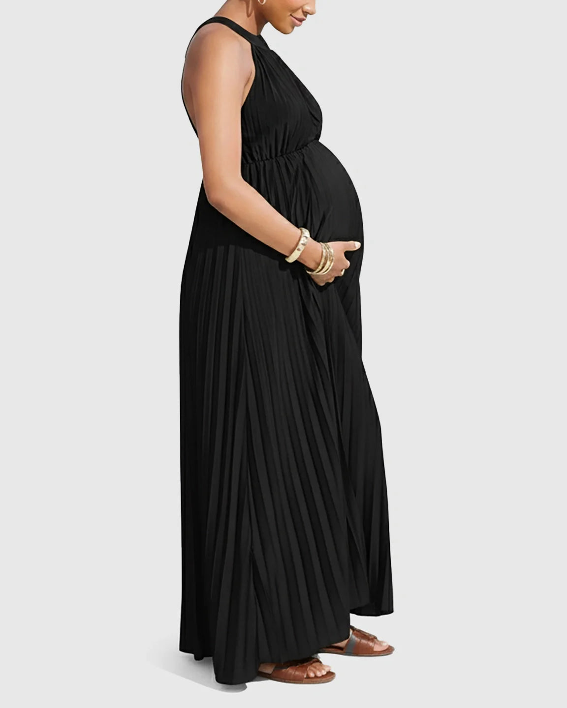 Black faux silk halter neck pleated maternity maxi dress on a pregnant woman.