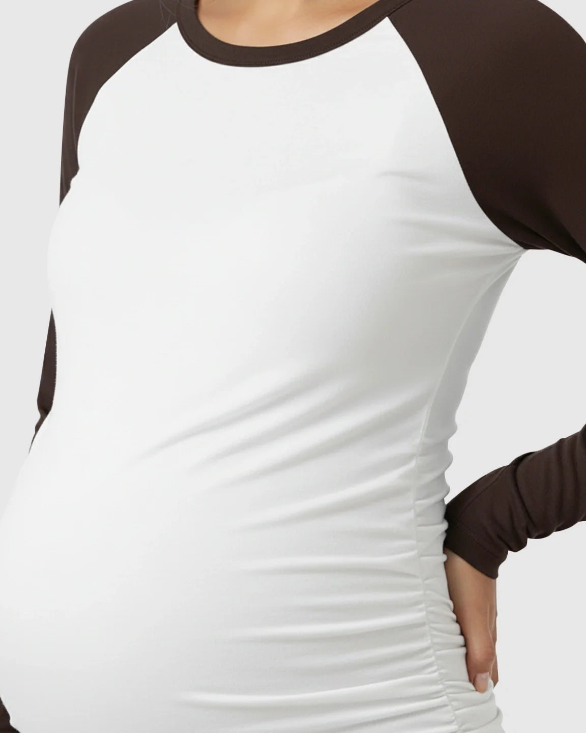 White and brown raglan sleeve maternity top with side ruching, made from smooth, high-elastic polyester.