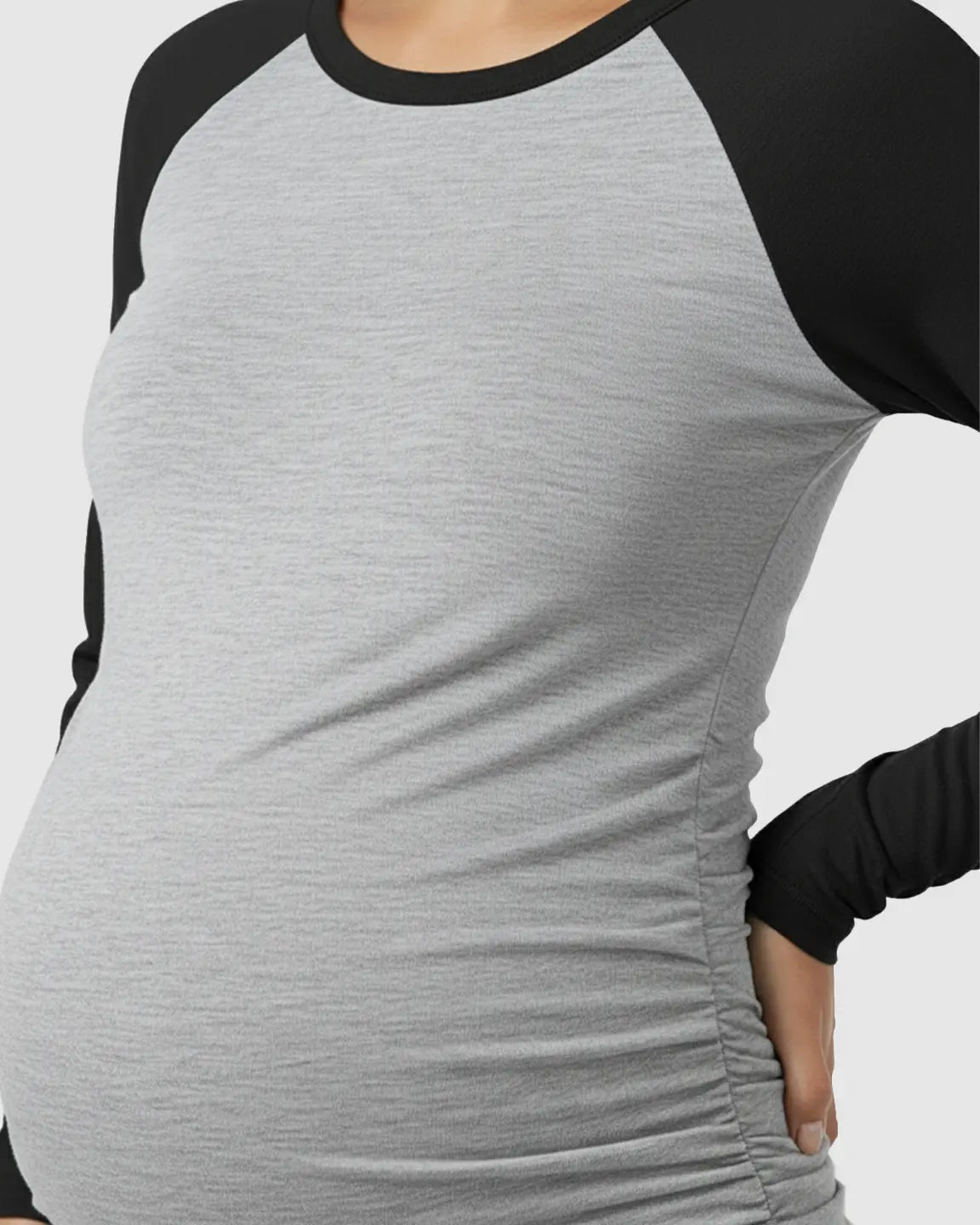 Gray and black raglan sleeve maternity top with side ruching, designed for a comfortable stretch fit.