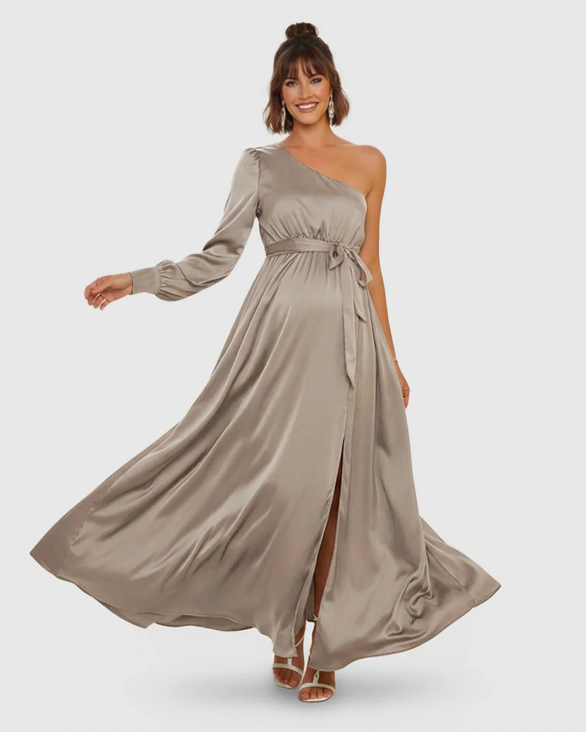 Elegant one-shoulder satin maternity maxi dress in taupe with a tie-waist and high slit.