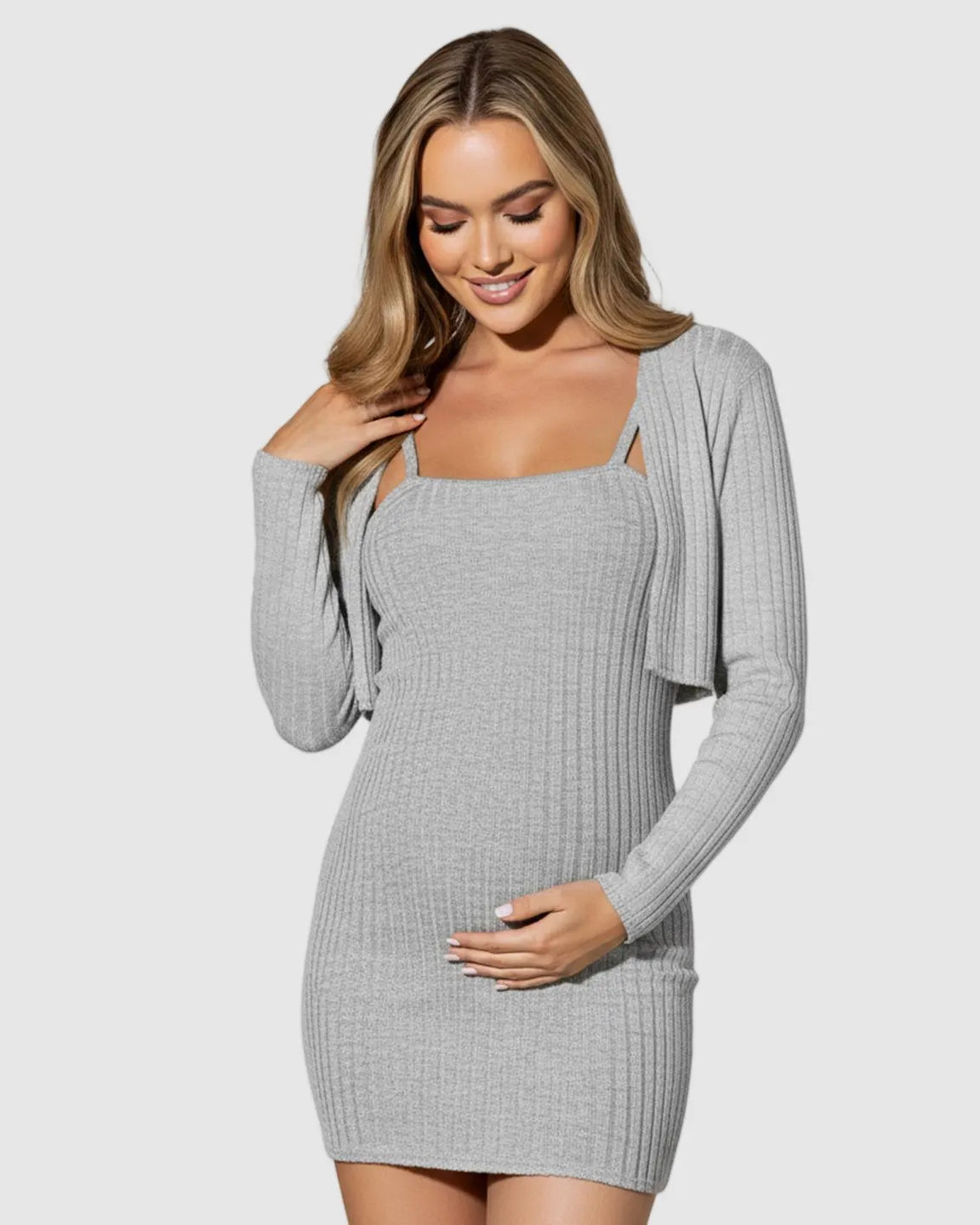 Smiling pregnant woman in a grey ribbed two-piece maternity bolero bodycon dress set.