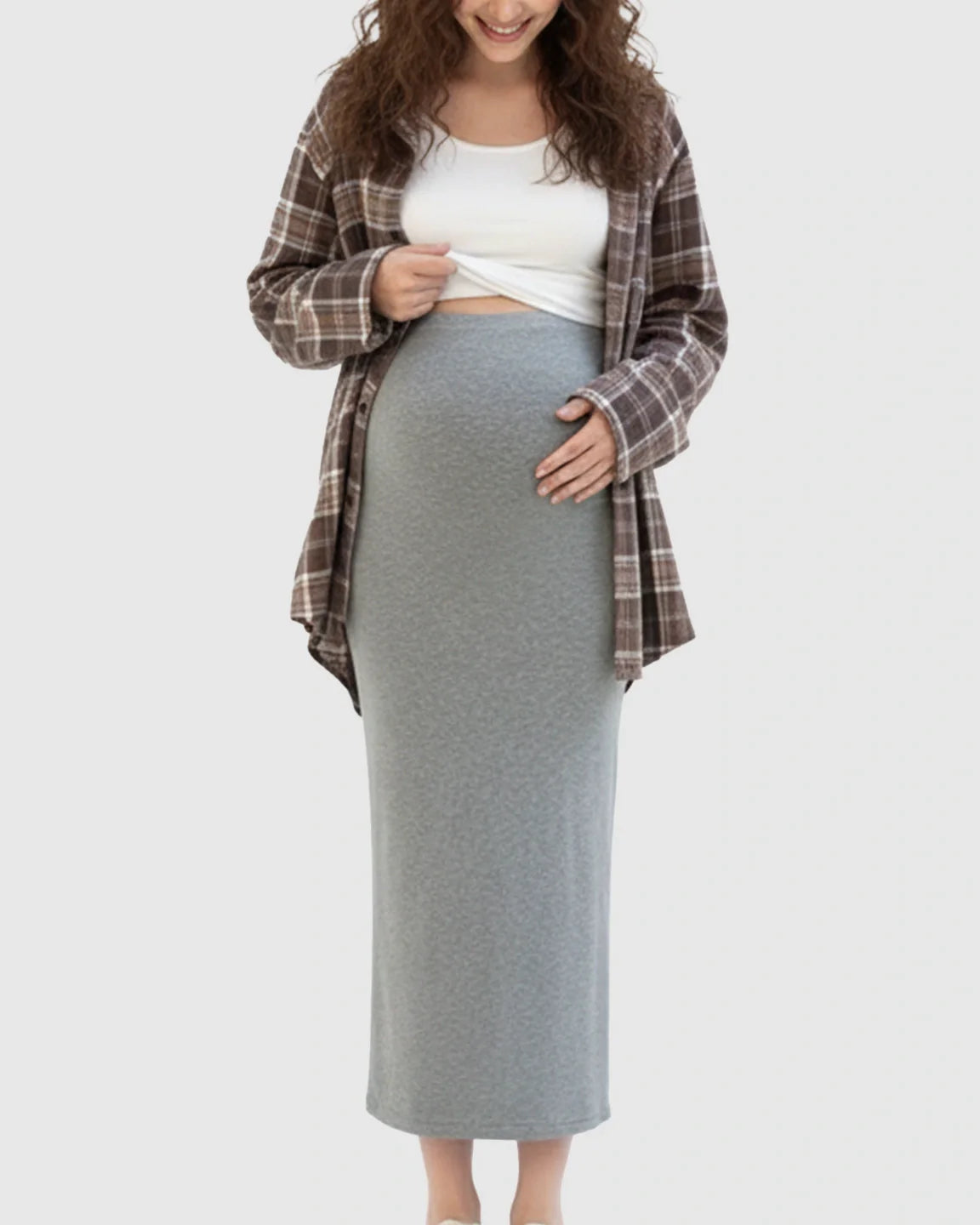 Maternity midi skirt in soft gray viscose blend, worn by a pregnant woman.