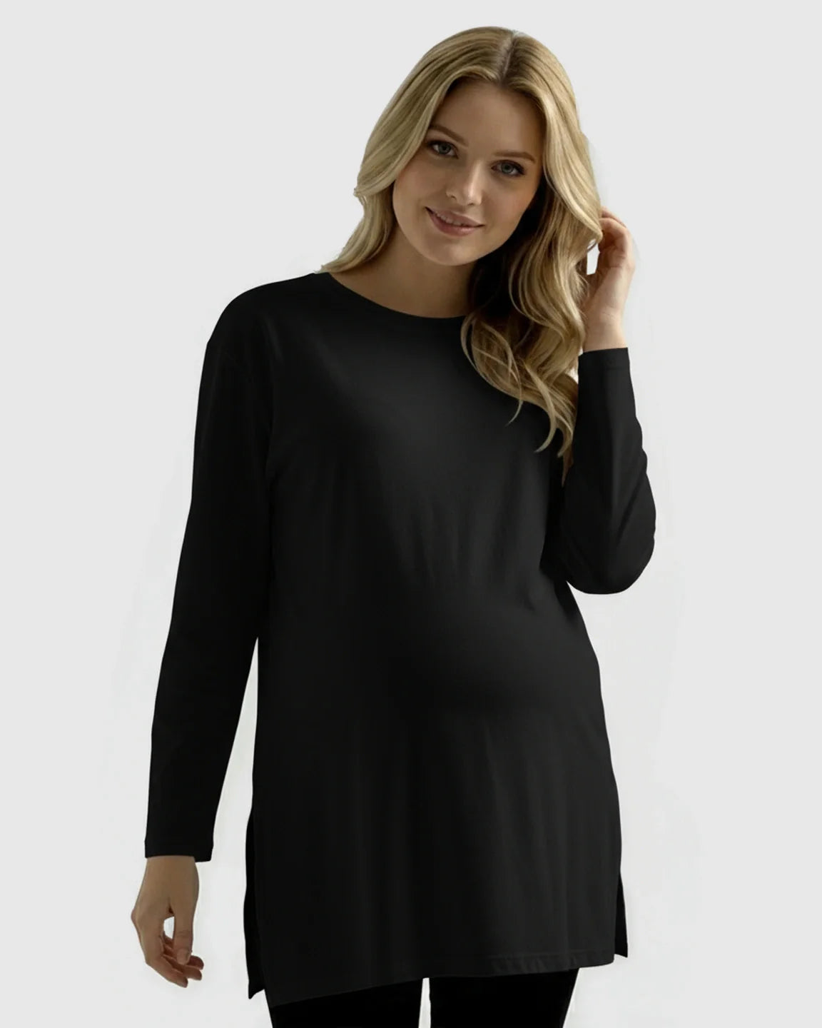 Blonde pregnant woman wearing a black, long-sleeve, soft cotton maternity top with a relaxed fit.