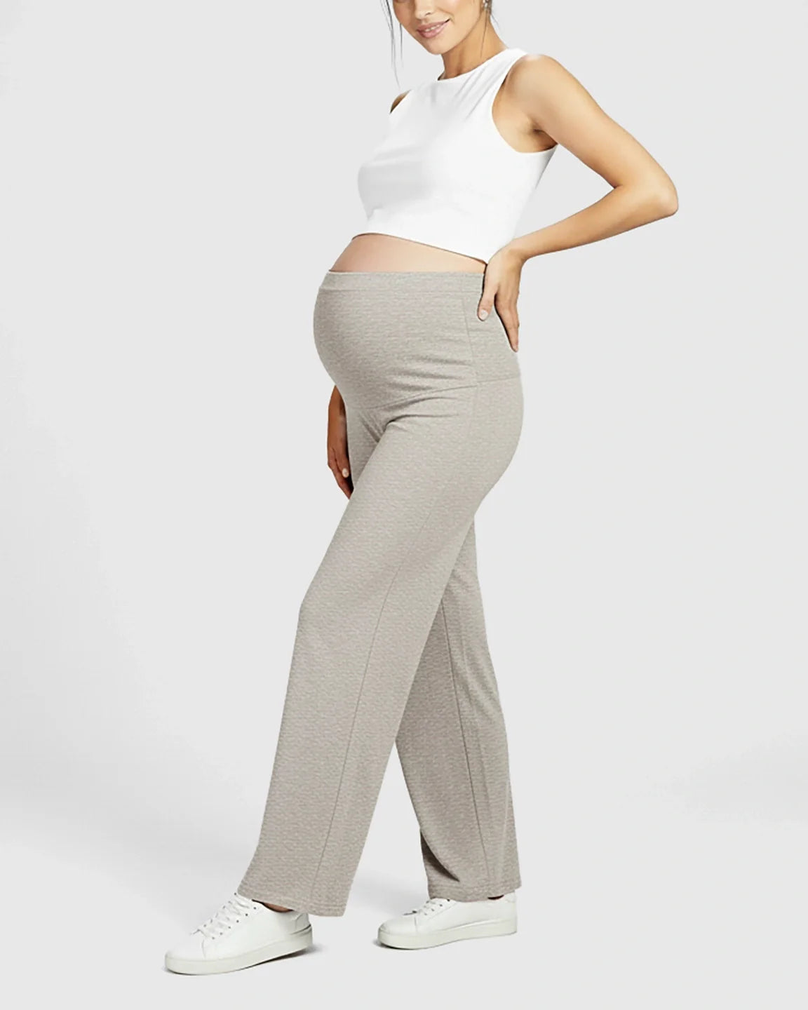 Pregnant woman in light gray Comfort Fit Elastic Waist Maternity Pants and a white crop top.