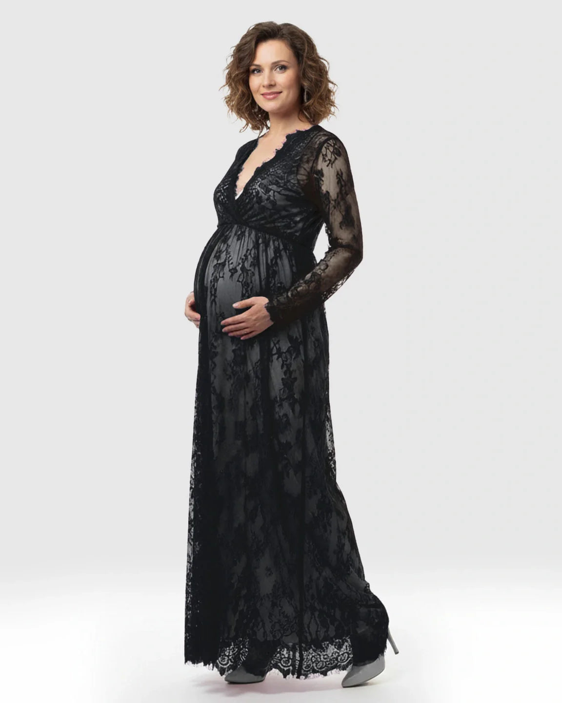 Maternity maxi dress in black sheer floral lace, featuring an empire waist, V-neck, and long sleeves.