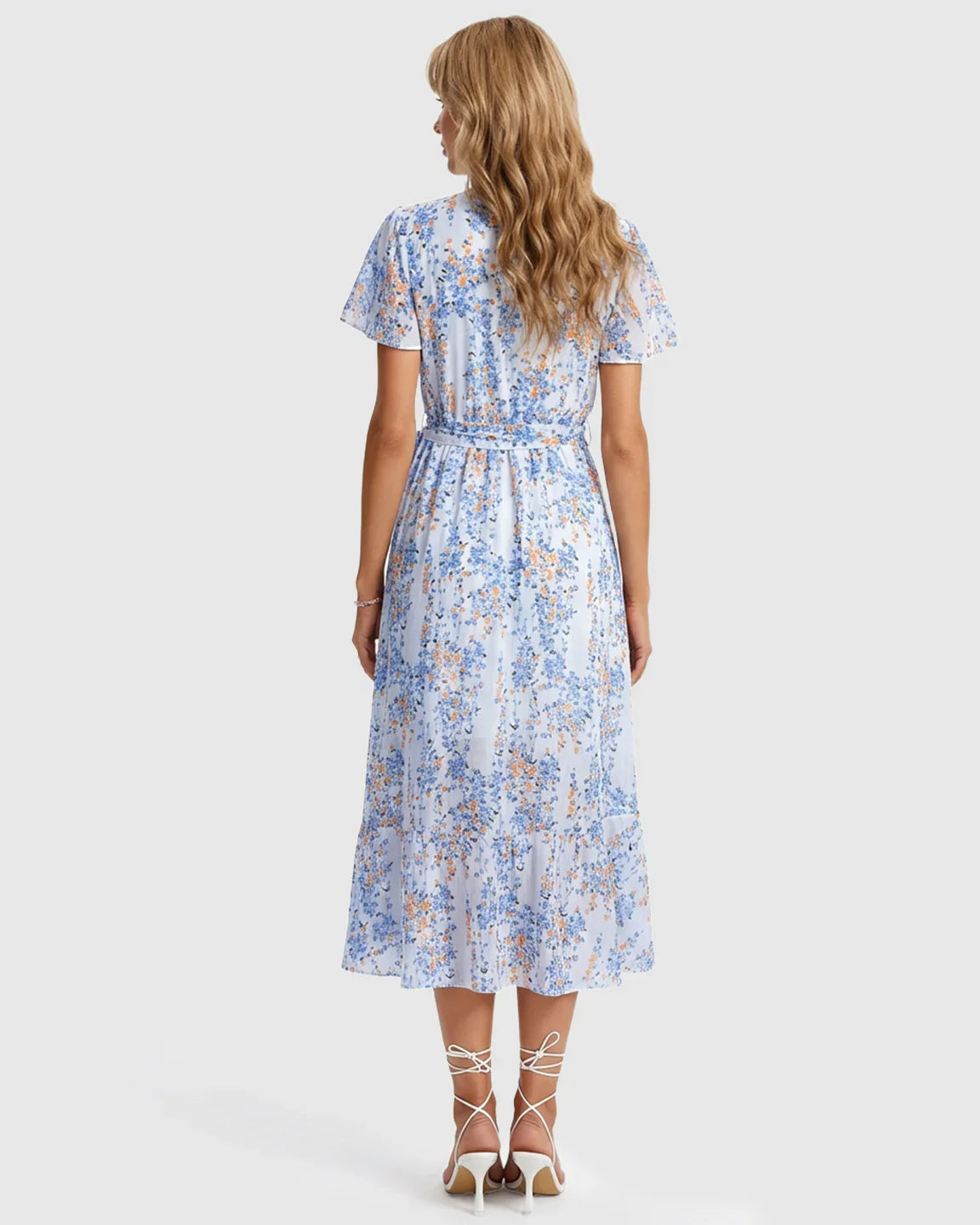 Maternity midi dress in light blue floral print with V-neck, short sleeves, tie waist, and ruffled hem.