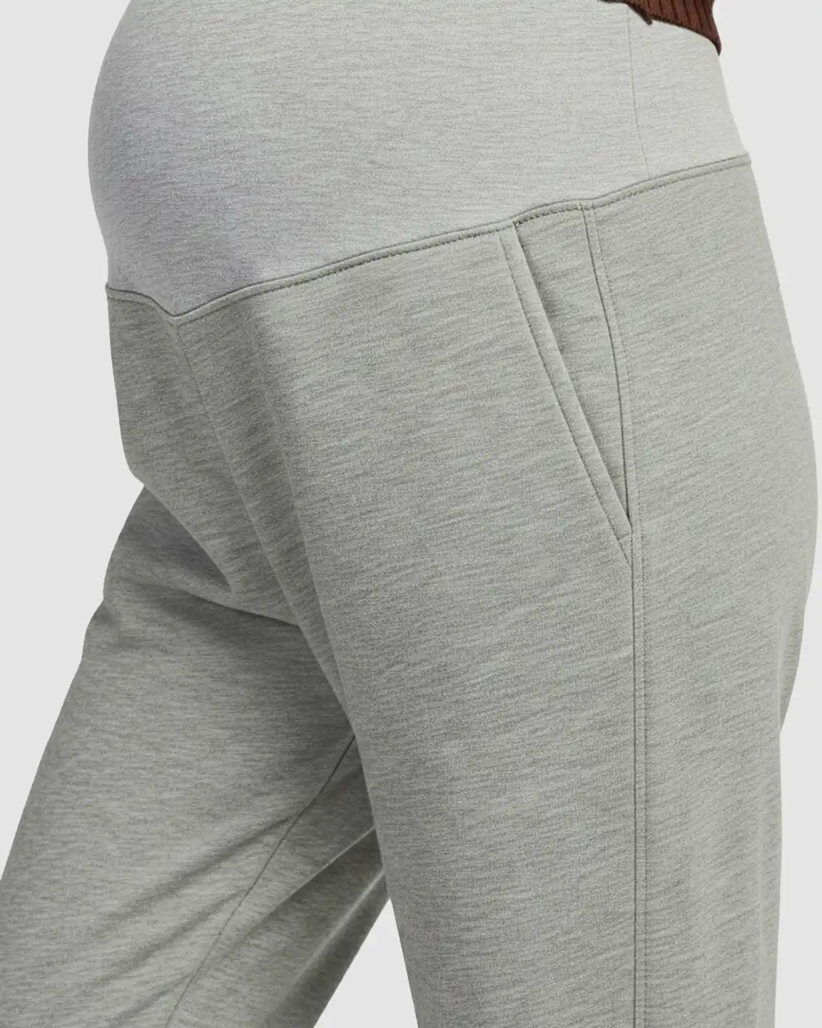 Light gray soft knit maternity joggers with a supportive waistband and side pockets.