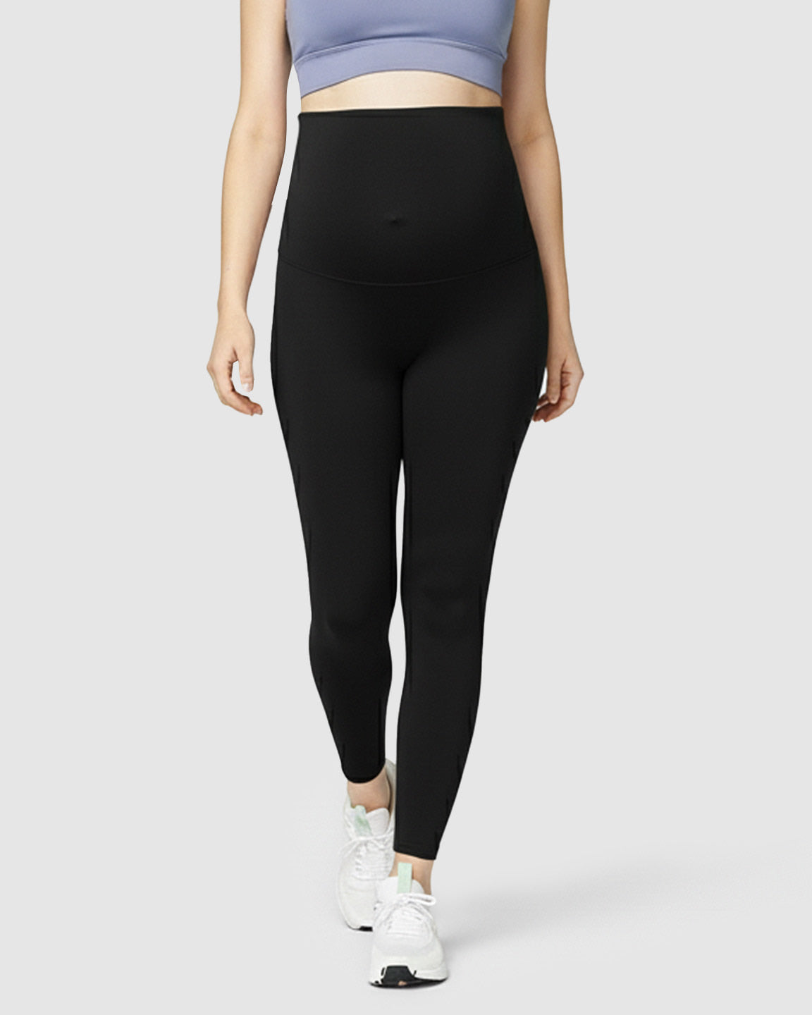 Black high-waist soft stretch maternity leggings with full bump support, worn by a pregnant woman.