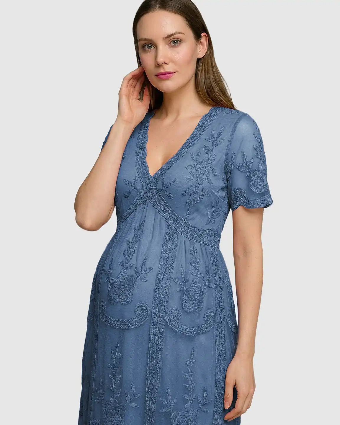 Maternity midi dress in blue lace with V-neck, three-quarter sleeves, and swing skirt, featuring floral embroidery.