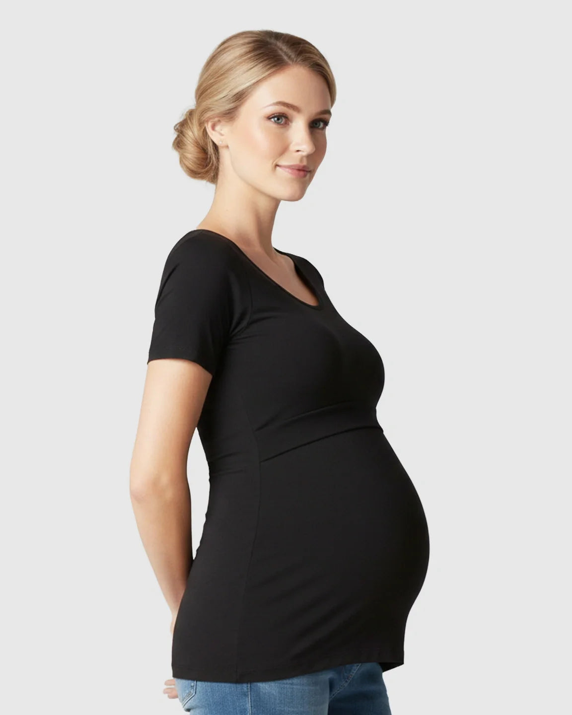 Pregnant woman in a black stretch-fit V-neck nursing t-shirt, designed for comfort and easy access.