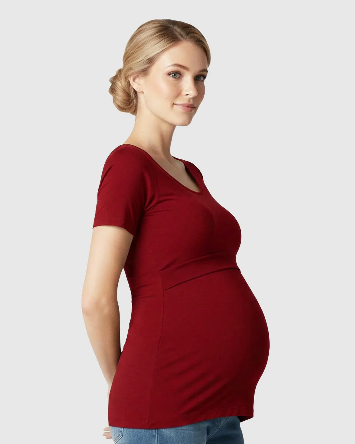 Pregnant woman in a red stretch-fit V-neck nursing t-shirt, designed for comfort and easy access.