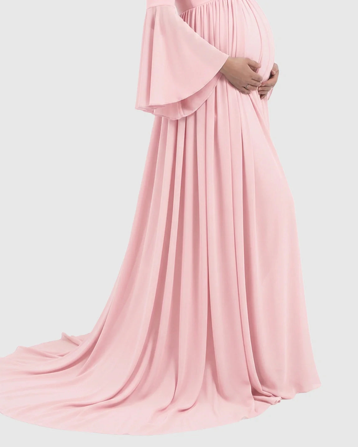 Pink chiffon maternity gown with bell sleeves and a long train, flowing over a pregnant belly.