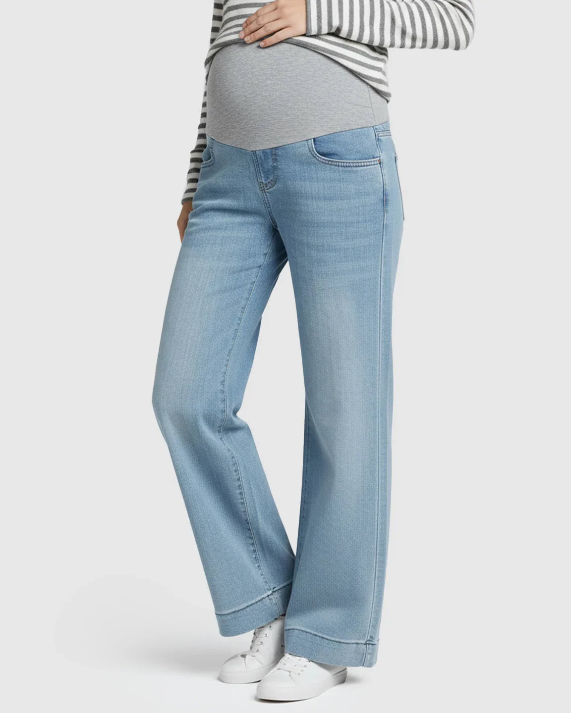 Light wash wide leg maternity jeans with a grey belly band and folded hem.