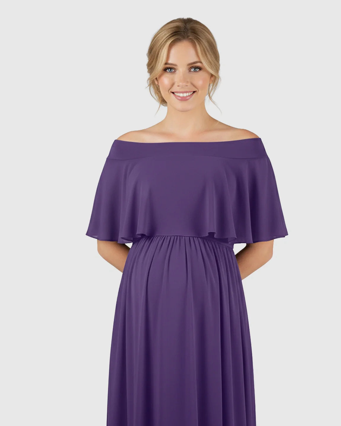 Smiling pregnant woman in a flowing purple chiffon off-shoulder bohemian maternity photoshoot dress.